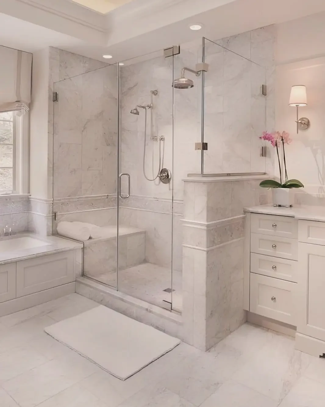 Luxury bathroom renovation by JMR Construction — premium marble tile work, frameless glass enclosure, and spa-quality finishes, Westchester County NY